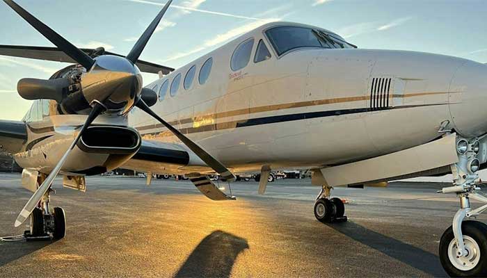 white-king-air-parked-at-facility-during-sunset