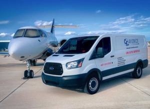 avionics-hangar-showing-parked-ce-avionics-maintenance-van-and-plane-next to-it-with-blue-sky-in-background